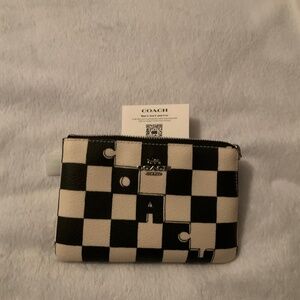 New Corner zip wristlet with checkerboard print goes with anything blk or white